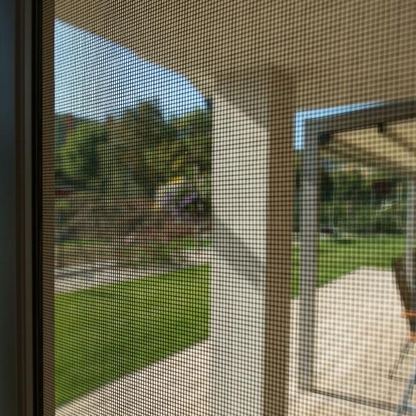 Sliding door insect net in rails